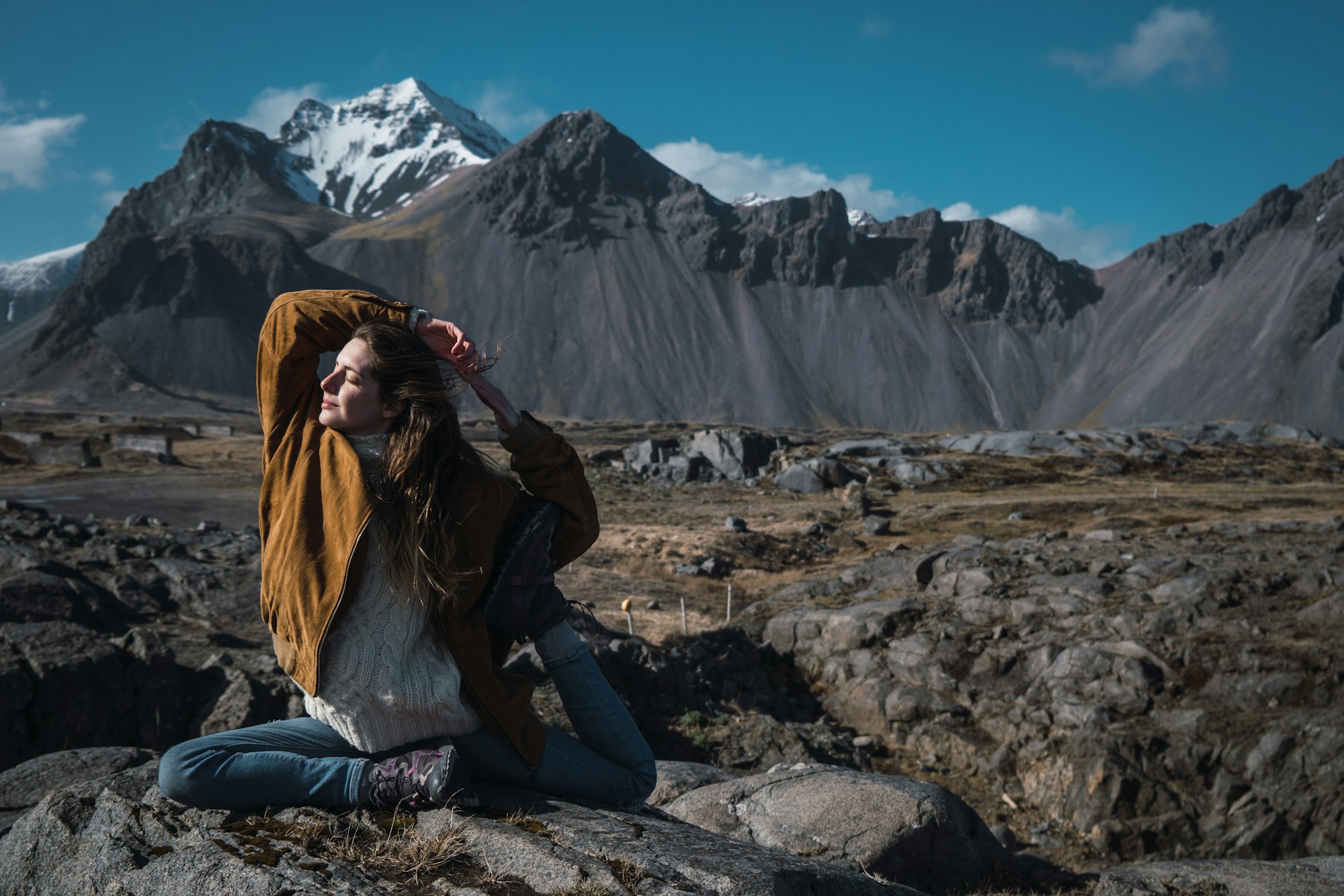 Woman doing yoga in mountains